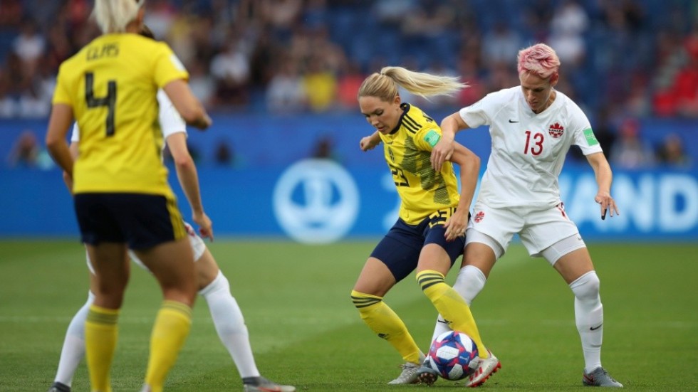 Canada's Sophie Schmidt, right, competes for the ball against Sweden's Elin Rubensson, center, during the Women's World Cup round of 16 soccer match between Canada and Sweden at Parc des Princes in Paris, France, Monday, June 24, 2019. (AP Photo/Francisco Seco)