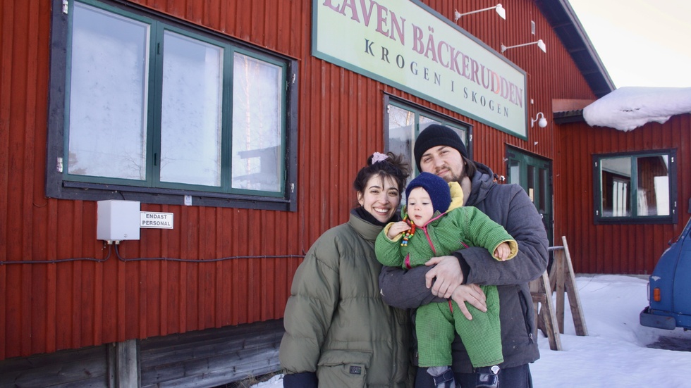 Helena Kreissel and Seba Soldo with their son Ando outside the mining hut.