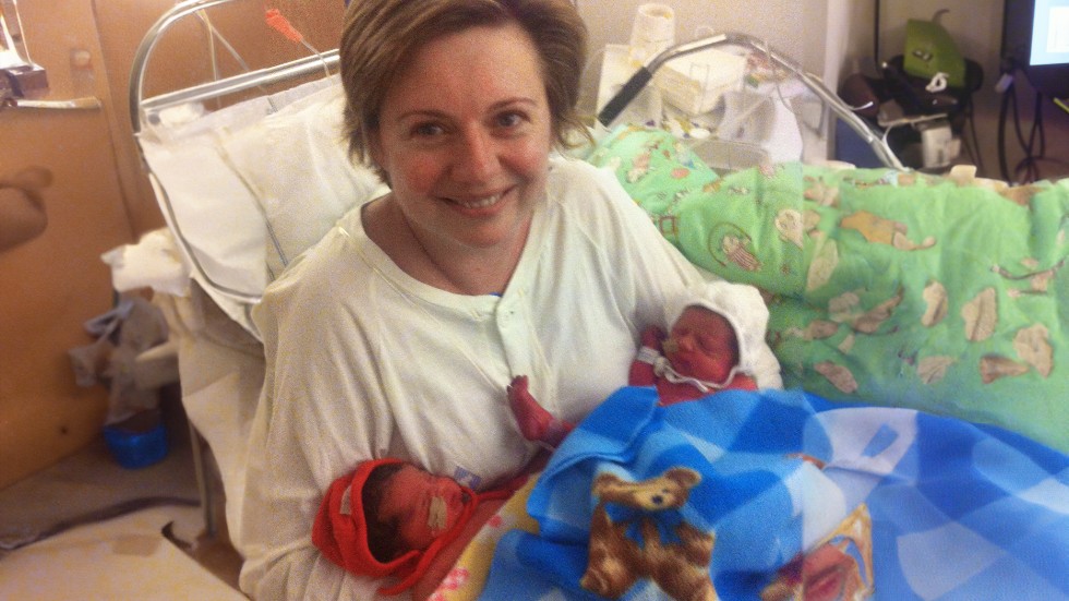 A happy Donna and her newborn twins, Leila, left, and Cailtin, right.