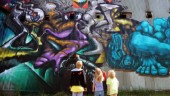 Turister vallfärdar till världens graffitiväggar