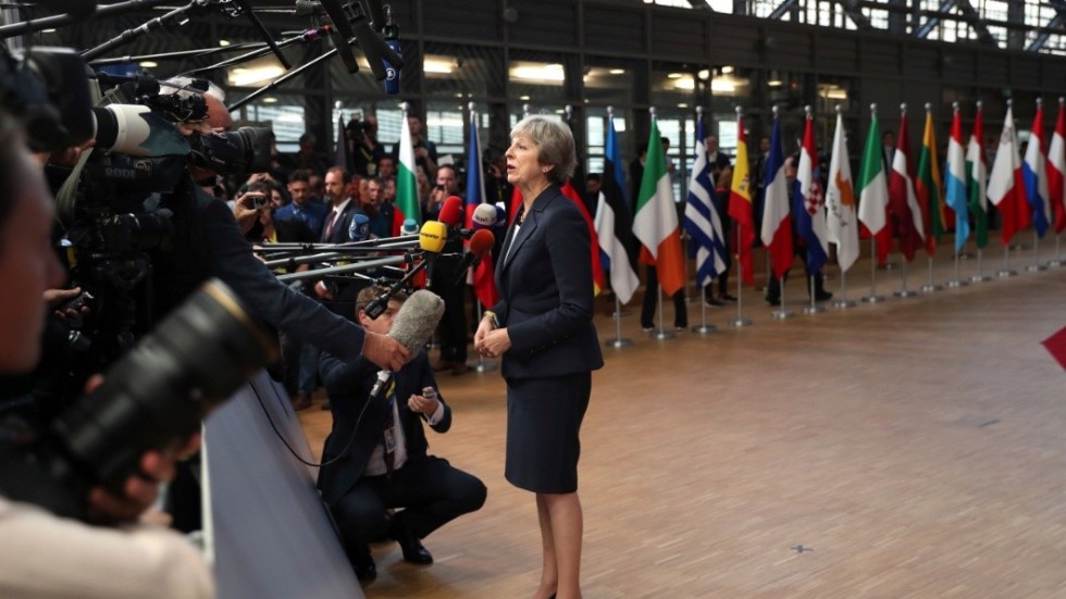 British Prime Minister Theresa May speaks with the media as she arrives for an EU summit in Brussels, Wednesday, Oct. 17, 2018.