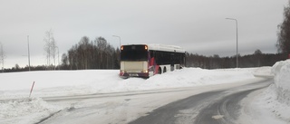 Blizzard news: Bus crashes into roundabout