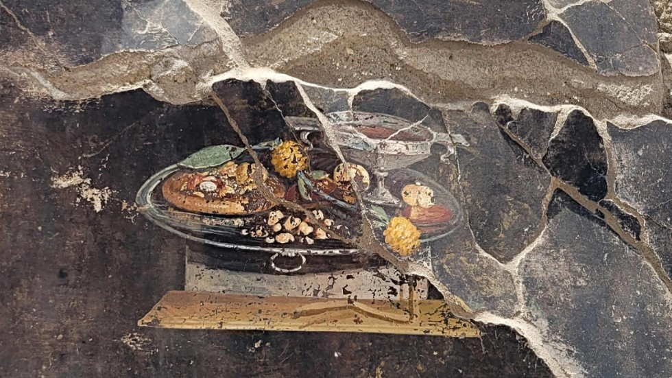 Den väggmålning som hittades i Pompeji i Italien föreställer inte en pizza.